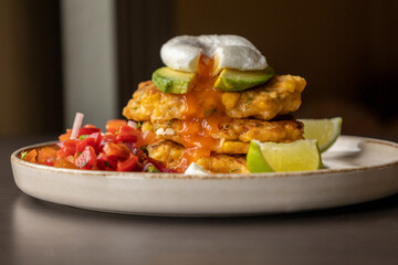  delicious corn fritters with salsa and poached egg – the perfect brunch
