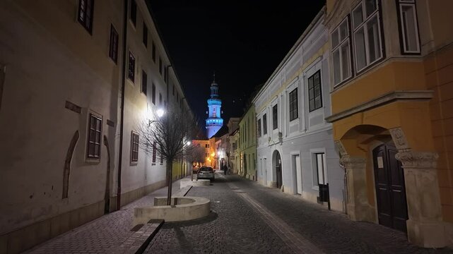 Shot of a calm night walk through the streets of Old Town of Sopron, Hungary, showcasing the historic architecture.