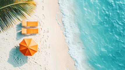 Naklejka premium Top view of a tropical beach with two orange lounge chairs and a matching umbrella on soft white sand, next to turquoise ocean waves.
