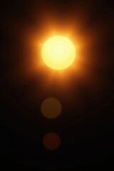Soft glowing sun with light leaks on black background, light leaks, radiance