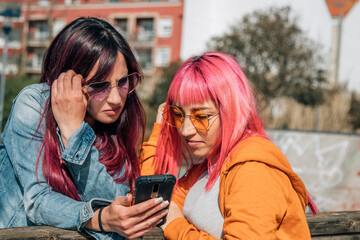 urban women on the street looking at the phone