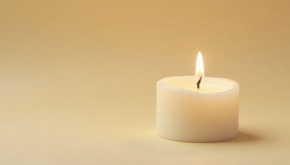Single white wax candle, small flame, beige background , sympathy, grief, contemplative