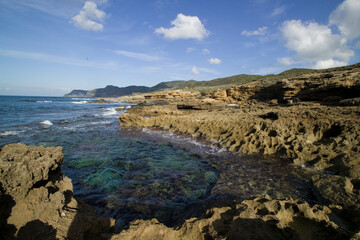 Obraz premium the roxky coast of Argentiera Porto Palmas- La Frana. Sassari, Sardinia, Italy