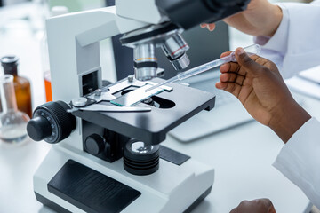 Teacher and a student working in a school scientific laboratory