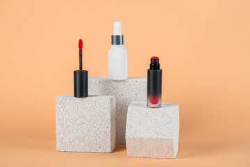 Mockup of black blank thin tube - mascara, lip gloss, gel, eyeliner, oil, etc. Cosmetic package with stylish props on cream background.