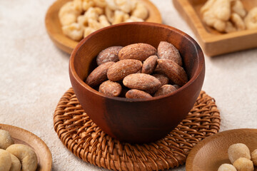 Flavored mixed nuts in bowls.