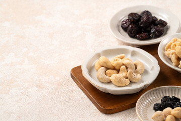 Flavored mixed nuts in bowls.