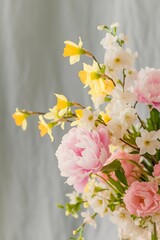 Obraz premium Spring flowers composition tender background beautiful fresh flowers on gray background