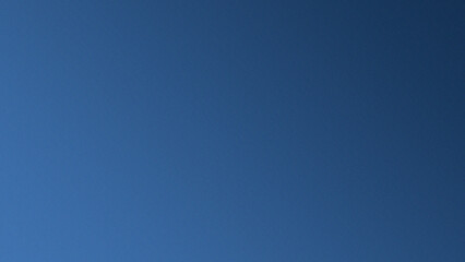 Abstarct background with a gradient of dark blue and light blue with a noise effect, suitable as a background for designs.