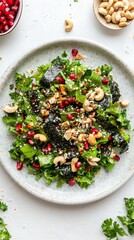 Playful and Colorful Scene: Green Salad with Nori Pieces, Pomegranate Arils, and Cashew Nuts