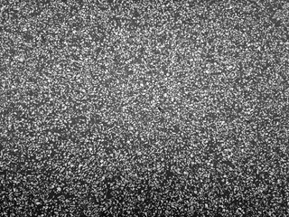 Classic terrazzo flooring with a dark base and scattered stone chips