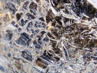 Macrophotography of the textured surface of black morion 10