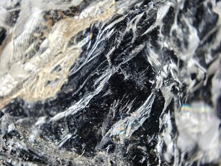 Macrophotography of the textured surface of black morion 1