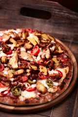 Gyros Pizza with jalapeno pepper, cherry tomatoes and mozzarella cheese. Soft focus. Close up.	
