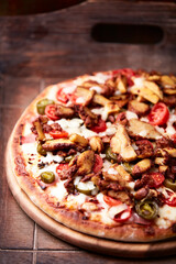 Gyros Pizza with jalapeno pepper, cherry tomatoes and mozzarella cheese. Soft focus. Close up.	