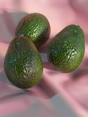 Three ripe avocados resting on a soft pink fabric backdrop.