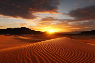 A breathtaking golden sunrise illuminates a vast desert landscape, casting intricate shadows on the rippled sand dunes, symbolizing tranquility and new beginnings.