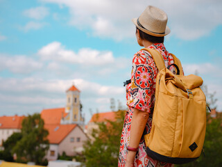 Obraz premium Beautiful woman walking of Varazdin streets during summer day in old, historical city center. Tourist exploring the beautiful streets, view on city from fortess