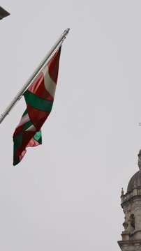The flag of the Basque Country flutters in the wind