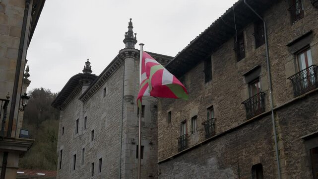 The flag of the Basque Country flutters in the wind