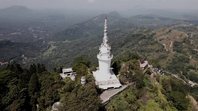 Cinematic Drone 4K. Ambuluwawa Tower is the first Multi Religious Centre in Sri Lanka.There's a Temple, Kovil, Mosque and a Church. The tower is an evocative of a Buddhist 'stupa' with a height of 48m