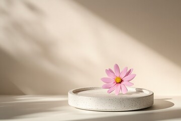 White, round podium with a pink flower on a beige background for product presentation, empty mockup, with soft shadows, high-resolution photography