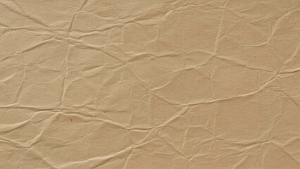 Fototapeta premium Wrinkled beige paper texture providing a vintage and artistic background for various creative projects