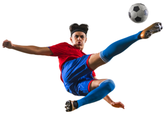 Portrait of young football player kicking ball in jump. Sportsman wearing red and blue uniform against transparent background. Concept of championship, action, team sport game, energy, vitality.