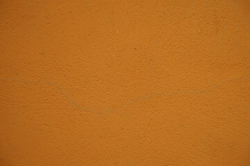 Close shot of bright orange painted wall