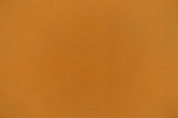 Closeup of bright orange painted wall