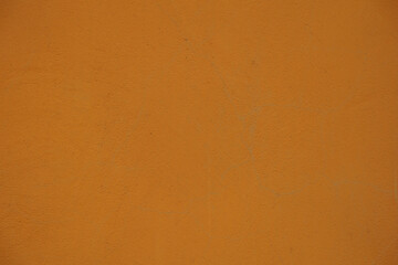 Macro of bright orange painted wall
