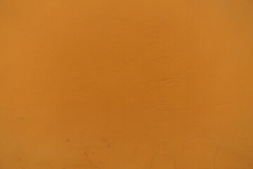 Surface of bright orange painted wall
