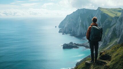 Person standing on rocky cliff overlooking ocean and dramatic coastline. Scenic outdoor landscape with steep cliffs, cloudy sky, and expansive sea. Travel and adventure concept. Generative AI