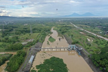 Very nice aerial view of river dam with mountain background