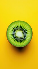 Fresh Kiwi Half on Bright Yellow Background for Creative Visuals