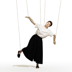 A woman with puppet hands on strings. Art collage.