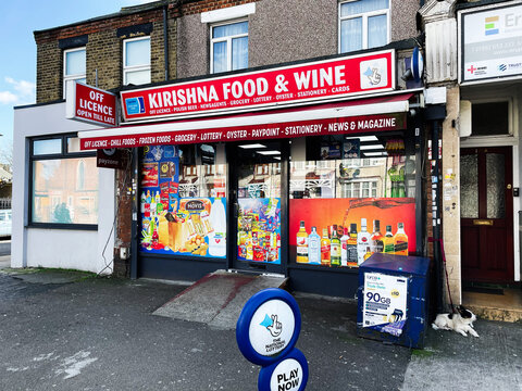 Exterior view of a local corner shop selling groceries and beverages
