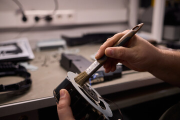 A Close Up and Detailed Examination of a Turbine Fan Component Held in Hand for Review