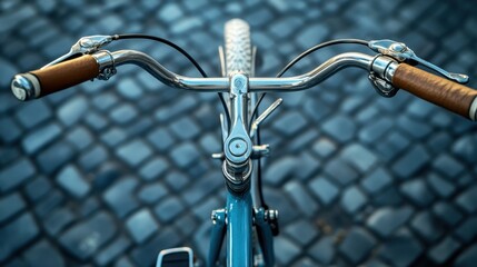 A bicycles handlebars with gear shifters and brake levers.