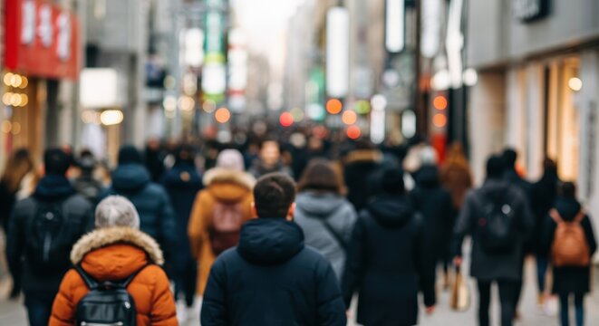 Diverse pedestrians moving along crowded winter shopping street, blending urban anonymity with dynamic consumer landscape and bustling metropolitan energy