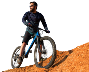 Cyclist in pants and fleece jacket on a modern carbon hardtail bike with an air suspension fork. The guy on the top of the hill rides a bike.