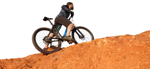 Cyclist in pants and fleece jacket on a modern carbon hardtail bike with an air suspension fork. The guy on the top of the hill rides a bike.