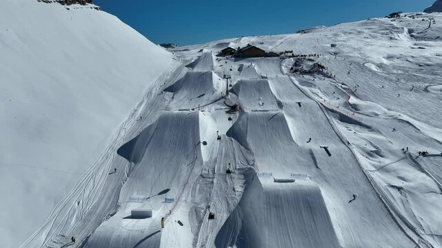 Aerial drone view of sunny winter in dolomites, alps. Italy, Madonna di Campiglio village and a ski resort in Italy. Madonna di Campiglio and ursus snowpark in Val Rendena dolomites trentino Italy.