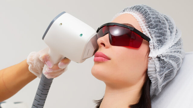 A woman undergoes cosmetic procedures using a bbl laser. Advertising concept for facial care, improving skin condition in a cosmetology clinic