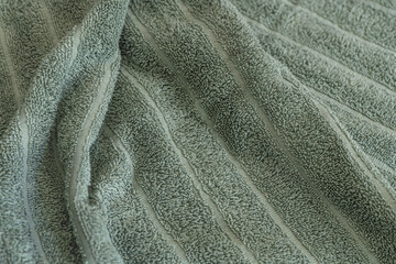 abstract background of light green terry towel texture close up shallow depth of field