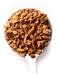 Spoon with aromatic instant coffee isolated on white, top view