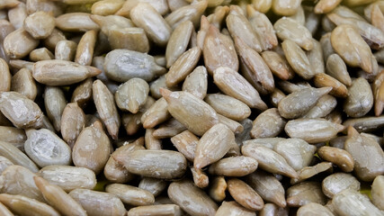 Sunflower seeds drying under natural light in a rural setting