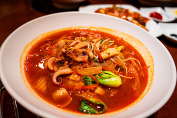 Jjamppong is a Korean noodle soup with red, spicy seafood
