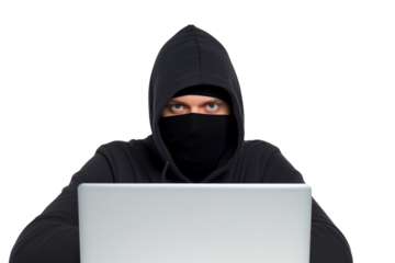 Serious young  male ethical hacker typing on laptop isolated on transparent white background