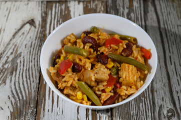 Savory rice medley with beans and vegetables served in a rustic bowl